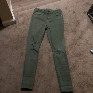Distressed army green jeans. Mid-rise. Regular